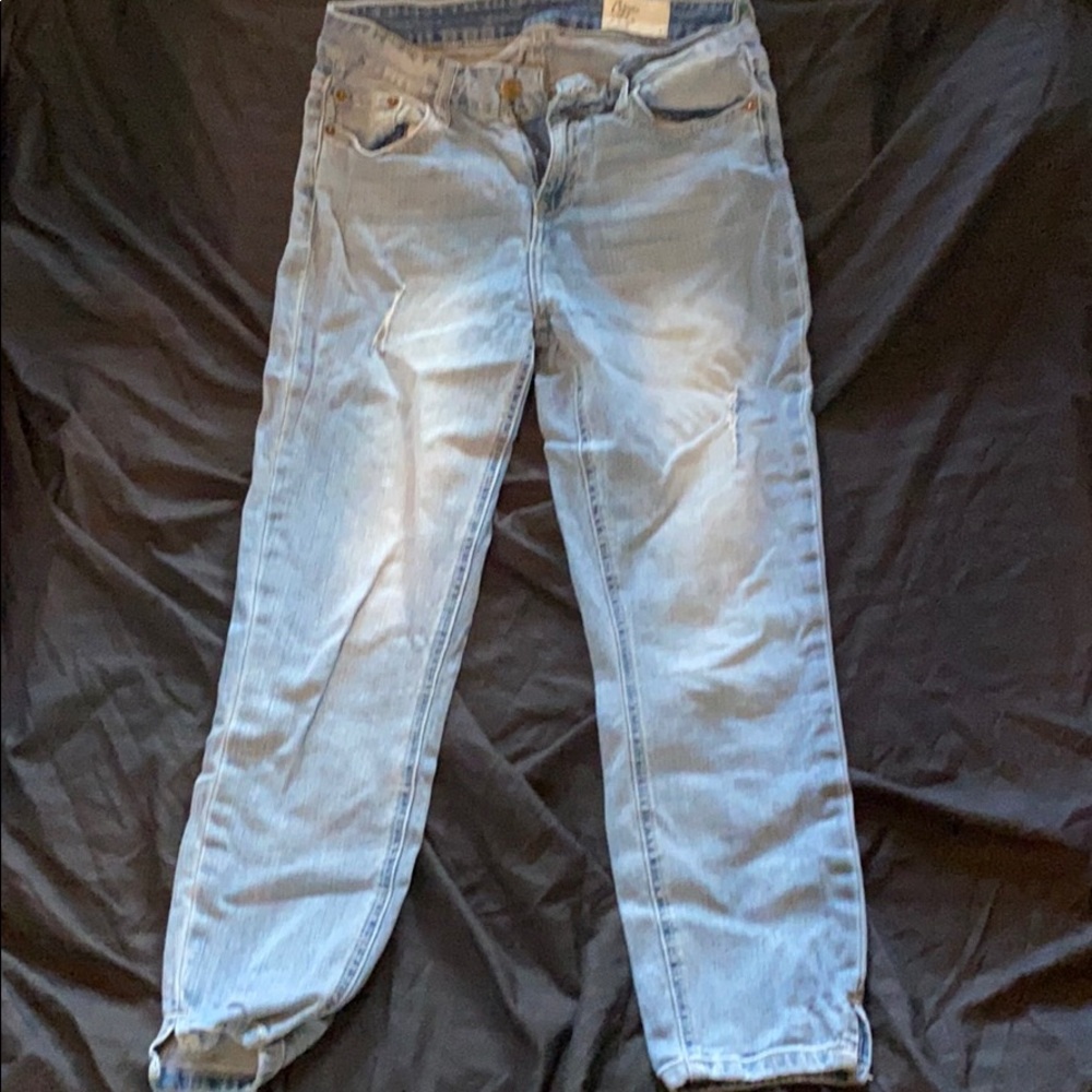 Distressed faded calf length jeans